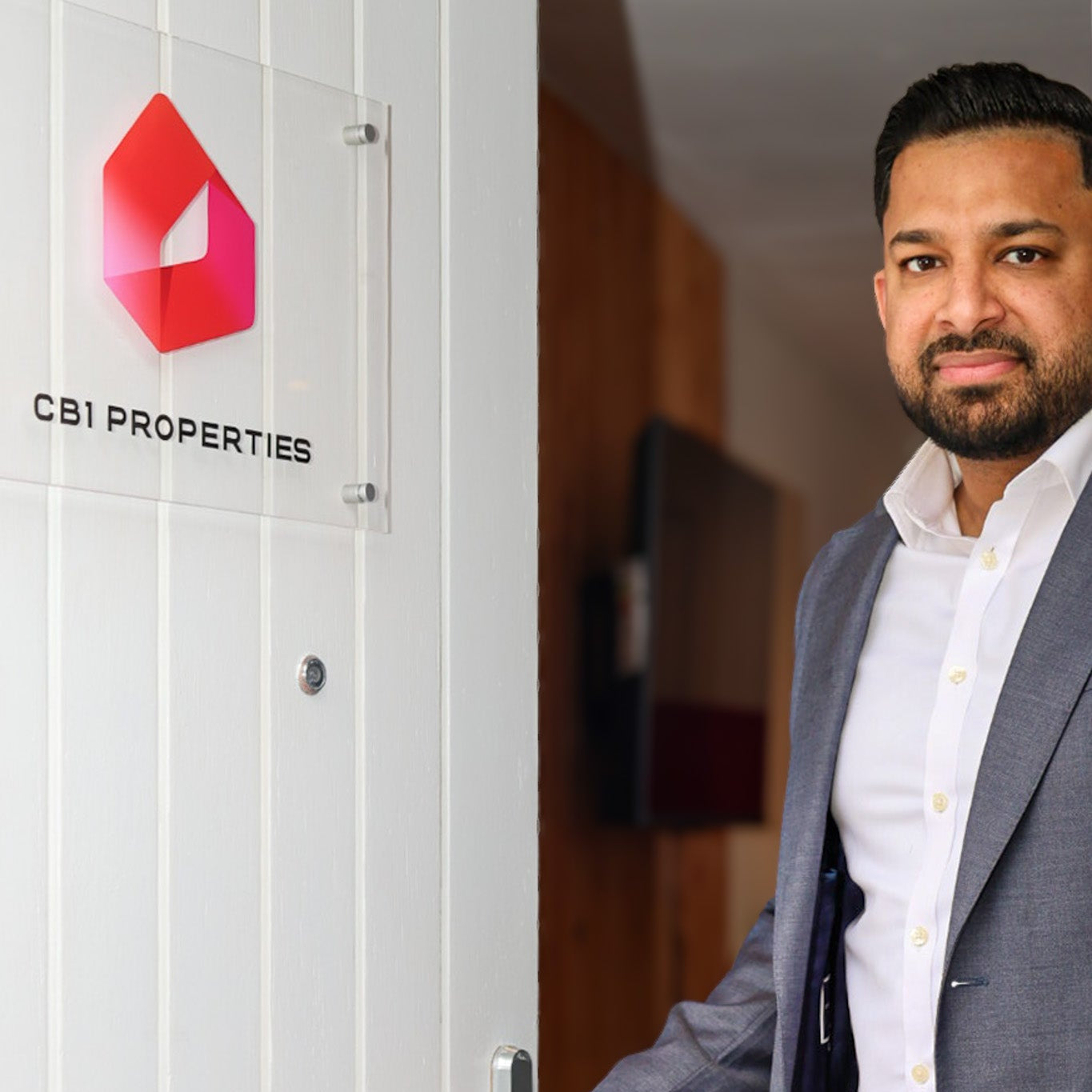Man standing in front of a door with CBI Properties logo